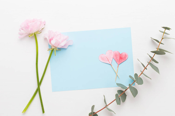 Beautiful colored ranunculus flowers on a white background. Valentines day greeting card. - 写真・画像