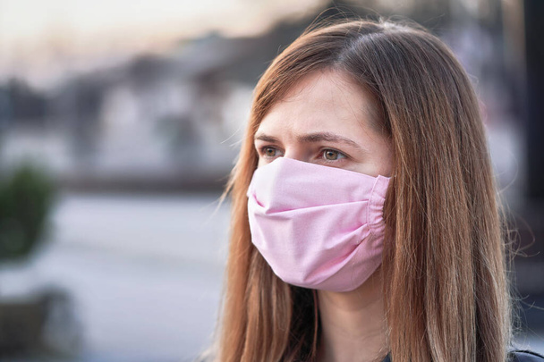 Young woman with hand made face nose mouth mask portrait, can be used during coronavirus covid-19 outbreak prevention - Фото, изображение