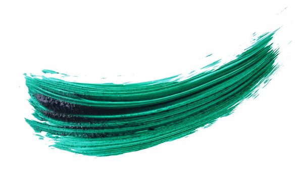 Abstract groene aquarelvlek geïsoleerd op witte achtergrond. Kleurrijke aquarelplons op papier, vloeibare verfspetters - Foto, afbeelding