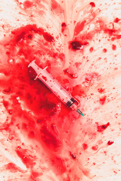 Bloody in sink with flowing red blood. Murder concept background. syringe - 写真・画像
