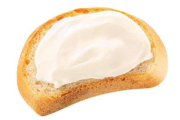 Bread baguette slice with cream cheese atop isolated, top view - Photo, Image