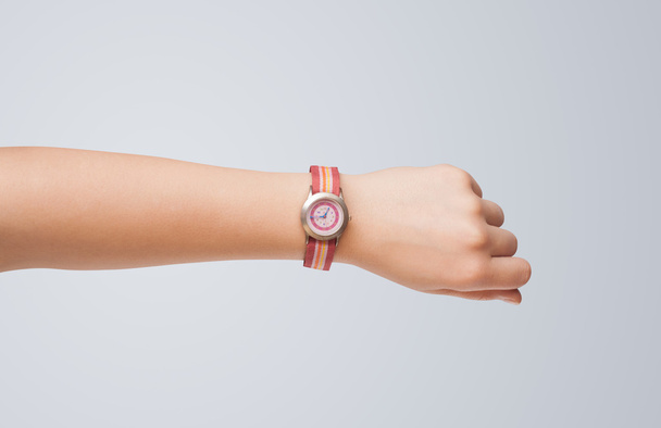 Hand with watch showing precise time - 写真・画像