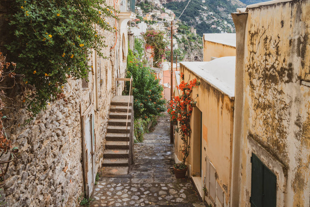 Typical narrow street and colorful houses in city of Positano, Amalfi coast, Italy - Photo, image