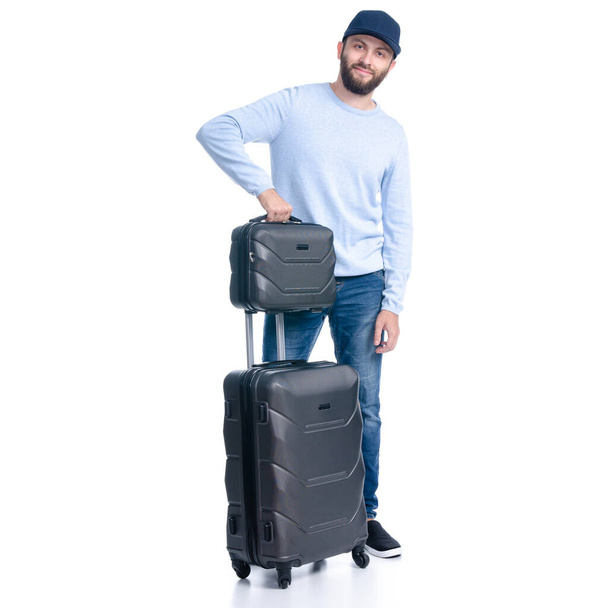 Man in jeans with travel suitcase standing - Zdjęcie, obraz