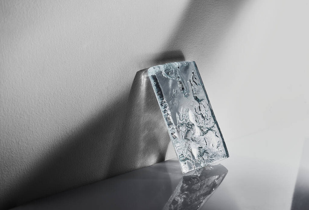 beautiful piece of glass with shadows on a white background - Φωτογραφία, εικόνα