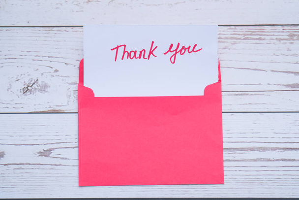Close up of thank you message, envelope on white  - Foto, Imagem