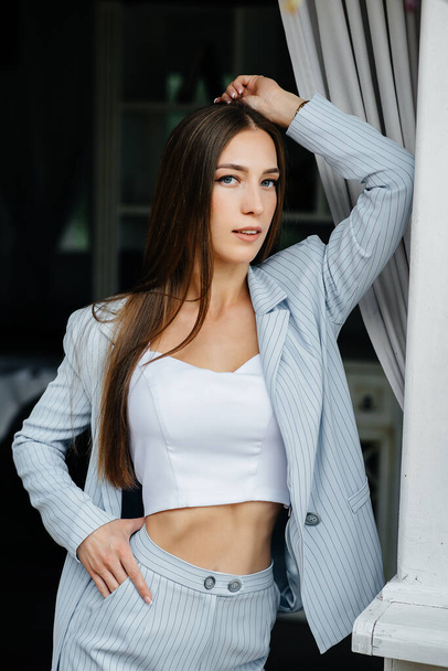 Beautiful young girl posing while relaxing, business woman. Relaxation. - 写真・画像