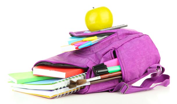 Purple backpack with school supplies isolated on white - Foto, imagen