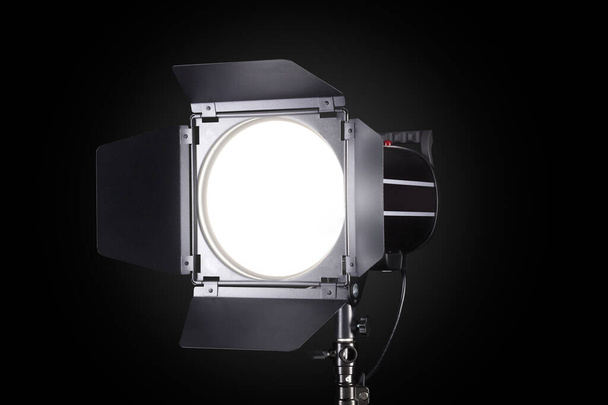Photography studio flash isolated on black background with lamp. - Zdjęcie, obraz