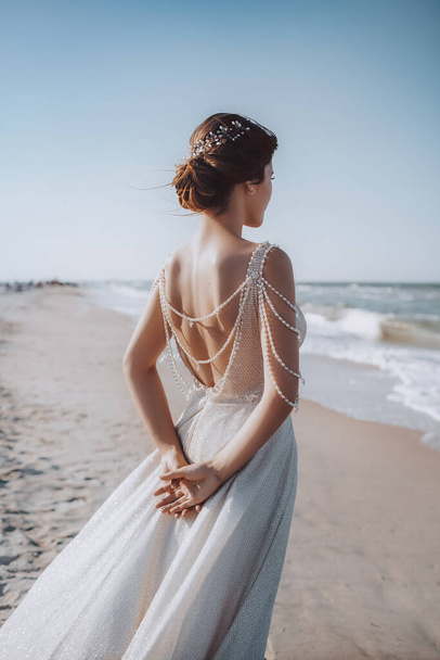 Beautiful Young Bride in White Wedding Dress Posing near sea - Foto, imagen