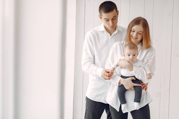 Beautiful family standing on a white background - Photo, Image