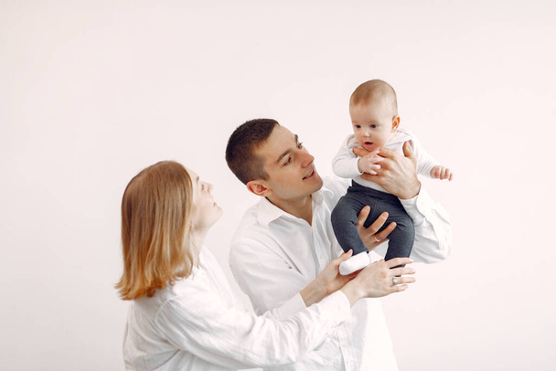 Beautiful family standing on a white background - Foto, Bild