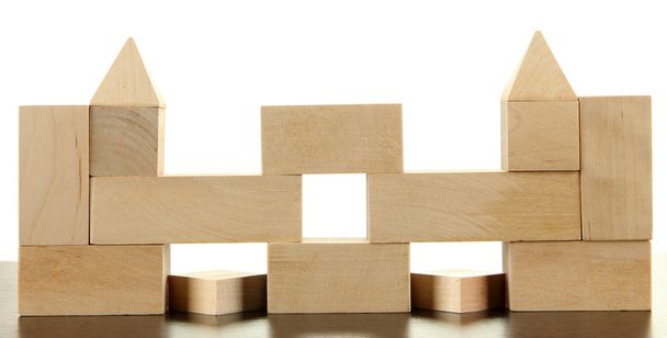Wooden toy blocks on table on white background - Foto, Bild