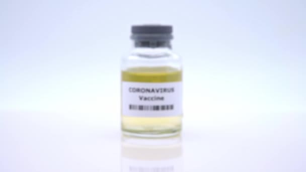 4K, Sample for Covid 19 vaccination isolated on white background. Preventive medications for Coronavirus 2019-nCov. Corona virus danger and public health risk disease. Asian flu outbreak pandemic-Dan - Кадри, відео