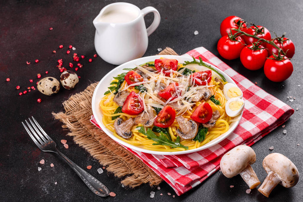Spaghetti with mushrooms, cheese, spinach, rukkola and cherry tomatoes. Italian dish, Mediterranean culture - Photo, Image