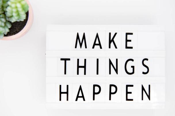 An inspirational motivating quote "Make things happen". Used in business, life and sports coaching this well known phrase or saying has become a rallying cry for getting things done. - Foto, Bild