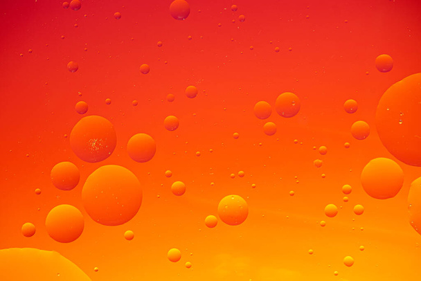 Bright abstract, red background with flying bubbles and copy space - Foto, afbeelding