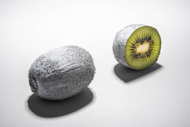 Modern Food Design. Monochrome Painted Kiwi Fruit Whole and Cut. Abstract Food Background. - Photo, Image