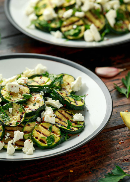 Warm salad with grilled zucchini, garlic and herbs - Photo, Image