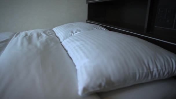4K A Double Bed With White Sheets In A Hotel Room-Dan - Footage, Video