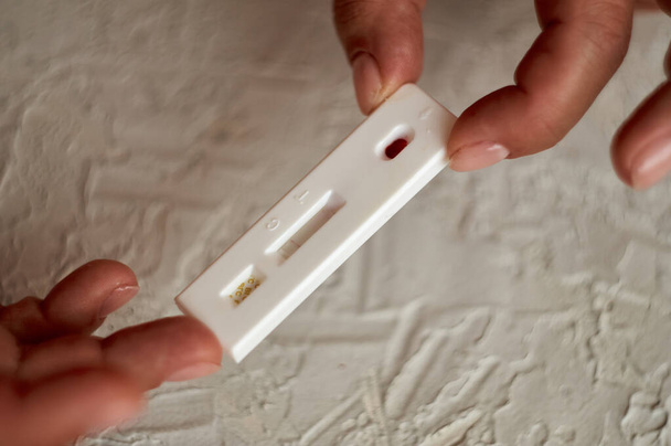 Self-testing of blood for viruses. The girl checks herself for hepatitis, herpes and Epstein-Barr virus, adenovirus, various sexual infections including syphilis, hiv and other infections. - Photo, Image