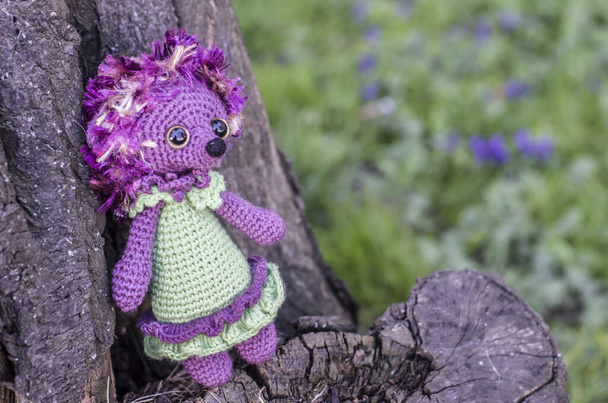 Crochet toy hedgehog on natural background. Cute handmade souvenir. - Photo, Image