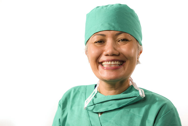 mature attractive and happy medicine doctor woman or hospital nurse in medical scrubs latex gloves and mask smiling confident isolated on white background - Φωτογραφία, εικόνα