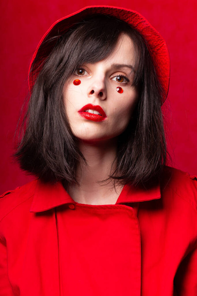 beautiful girl in red, close-up portrait - Fotó, kép