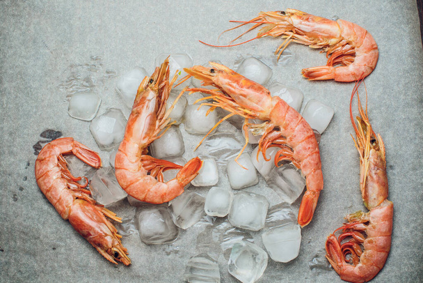 Prawns with lemon and rosemary. Top view. Square image. - Photo, image