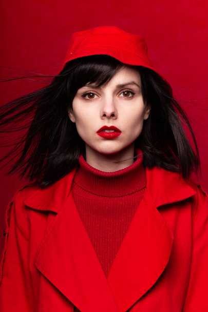 beautiful woman in a red coat - 写真・画像