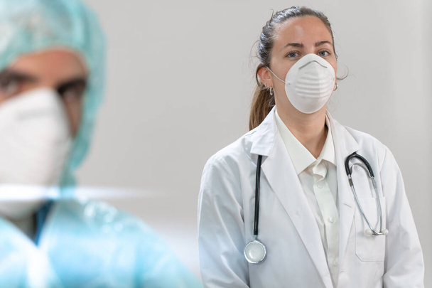 Coronavirus. Portrait of doctors and nurses working in the hospitals and fighting the coronavirus. Doctors are heroes. Doctors in the protective suits and masks looking for a cure for the disease.  - Foto, Imagen
