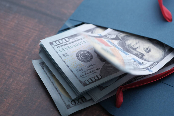close up of US dollar cash in envelope. - Фото, зображення
