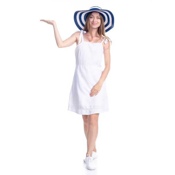 Woman in dress and summer hat smiling happiness standing pointing showing - Φωτογραφία, εικόνα