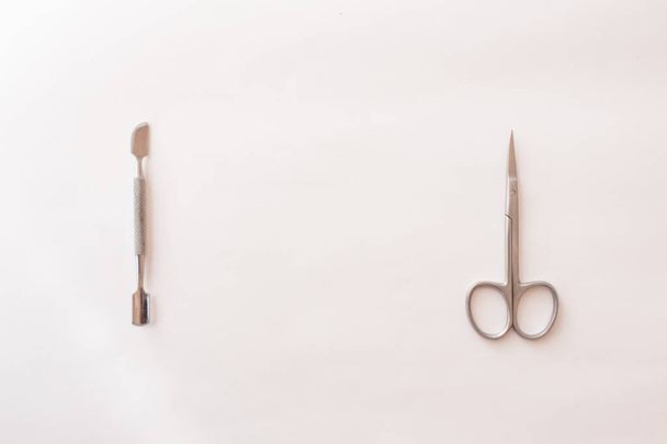  set of tools for manicure on a white background close-up. top view, text space - Φωτογραφία, εικόνα