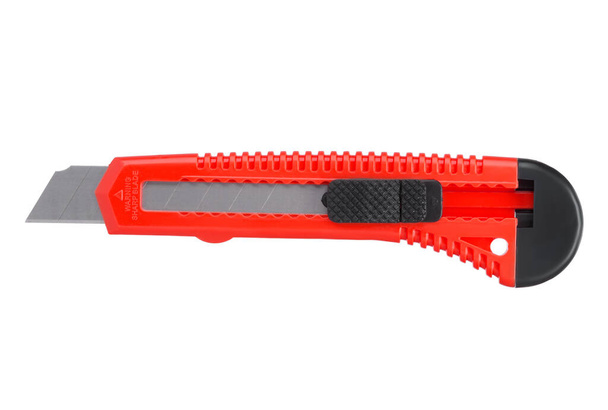 Červený psací nůž s čepelí izolovanou na bílém podstavci - Fotografie, Obrázek