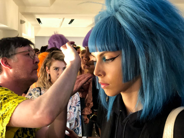 NEW YORK, NEW YORK - SEPTEMBER 06: A model getting ready backstage for the Jeremy Scott runway show during NYFW at Spring Studios on September 06, 2019 in NYC - Photo, image