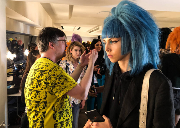 NEW YORK, NEW YORK - SEPTEMBER 06: A model getting ready backstage for the Jeremy Scott runway show during NYFW at Spring Studios on September 06, 2019 in NYC - Photo, Image