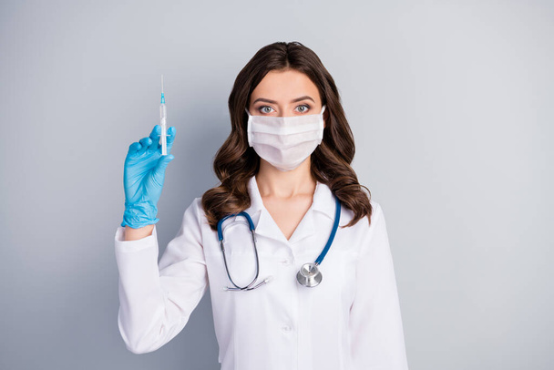 Portrait of professional corona virus infection specialist girl have medical mask latex gloves want vaccine patient stop covid-29 spread contamination isolated over gray color background - Foto, immagini