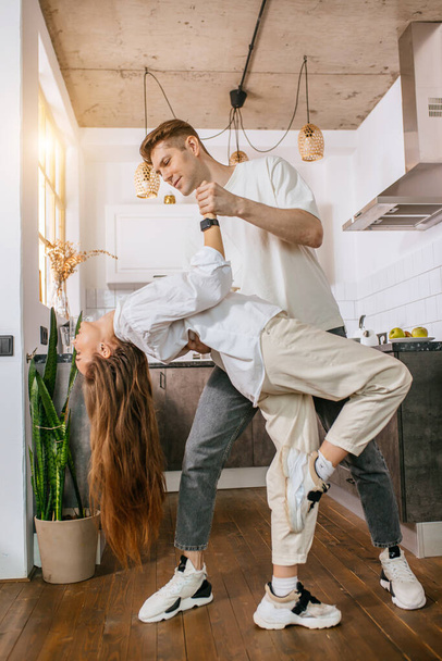 happy young couple dancing at home - Foto, Imagen