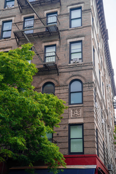 New York City, USA - May 30, 2019: Corner of Bedford Street with Grove Street in Greenwich Village, featured in Friends the famous American Television sitcom - Φωτογραφία, εικόνα