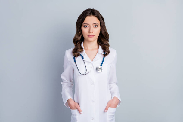 Portrait of her she nice attractive content skilled expert wavy-haired girl doc sickness ill disease prevention career surgeon assistant isolated over grey pastel color background - Foto, imagen