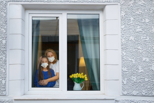 Quarantine window home for mother and daughter - Photo, Image