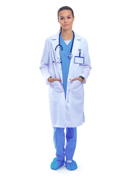 Beautiful young woman in white coat posing with hand in pocket. Woman doctor - Foto, imagen