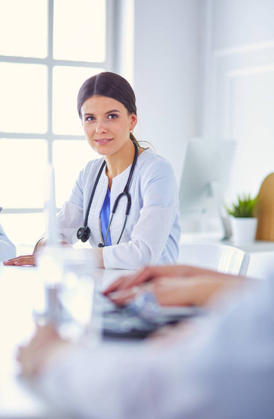Doctors consulting with each other in a hospital conference room - Foto, Imagen