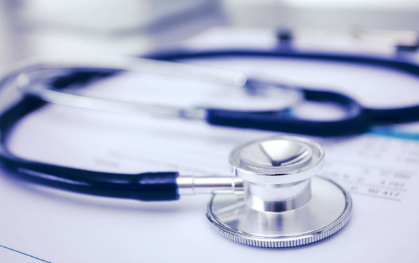 Medical equipment: blue stethoscope and tablet on white background. Medical equipment - Φωτογραφία, εικόνα