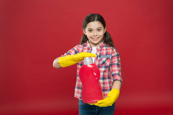 Disinfecting gels suitable for all family. Girl in rubber gloves for cleaning hold plastic bottle chemical liquid. Help clean up. Use product for cleaning. Housekeeping concept. Cleaning supplies - Zdjęcie, obraz