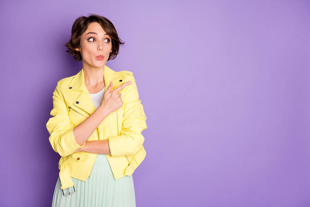 Portrait of astonished funky funny girl point index finger copyspace incredible advert impressed make lips pouted plump wear stylish clothes isolated over purple color background - Foto, afbeelding