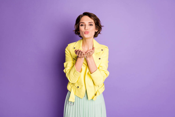 Portrait of coquettish positive nice girl have valentine day date send air kiss to her boyfriend wear good look outfit isolated over shine color background - 写真・画像