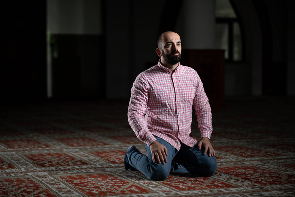 Muslim Man is Praying in the Mosque - Фото, изображение