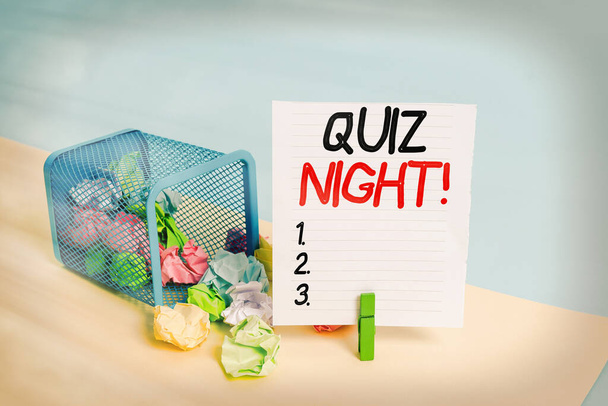 Conceptual hand writing showing Quiz Night. Business photo showcasing evening test knowledge competition between individuals Trash bin crumpled paper clothespin reminder office supplies. - Photo, Image